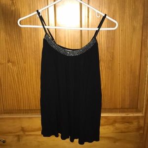 Black tank top work jewels around neckline